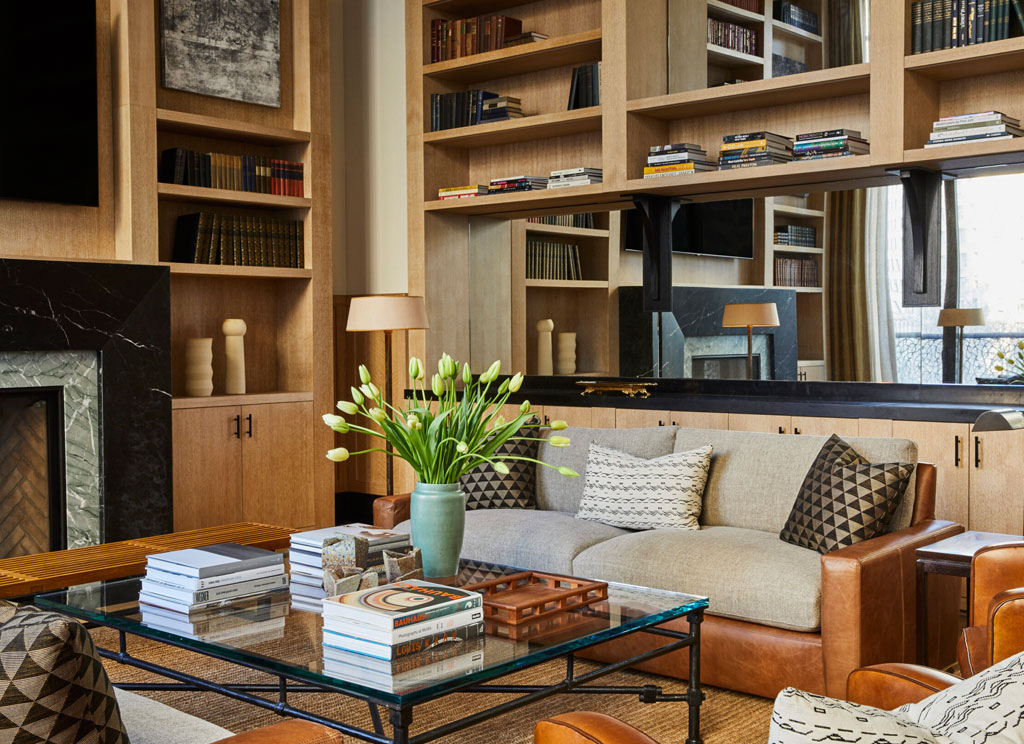 Custom wooden bookshelf near white sofa